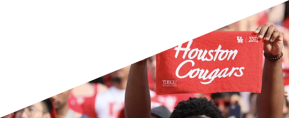 Fan holding a Houston Cougars Sign