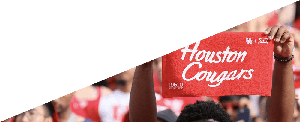 Fan holding a Houston Cougars Sign