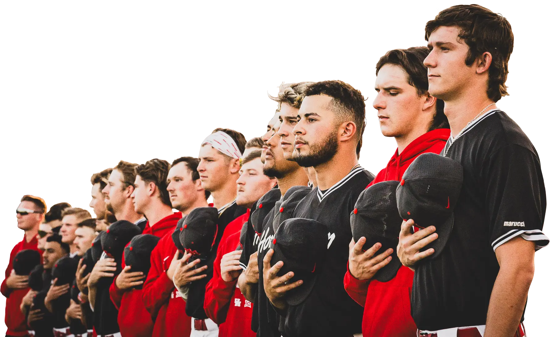 student-athletes holding hats over their chests