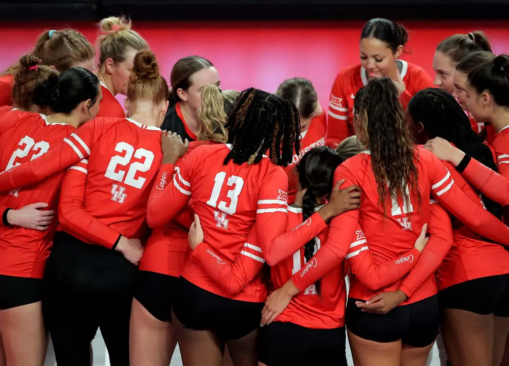 volleyball players in huddle